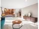 Open-concept living room with modern furniture and decor, creating a seamless flow for entertaining at 9930 W 82Nd Ave, Arvada, CO 80005