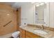 Well-maintained bathroom with granite countertops, updated fixtures, and tiled shower and bath combo at 655 S Alton Way # 6A, Denver, CO 80247