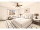 Bright and airy bedroom with neutral decor, ceiling fan and large window at 655 S Alton Way # 6A, Denver, CO 80247