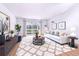 Stylishly decorated living room with modern furniture, bright natural light, and hardwood floors at 655 S Alton Way # 6A, Denver, CO 80247