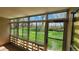 Cozy sunroom featuring floor-to-ceiling windows with a beautiful view of the green lawn and blue sky at 655 S Alton Way # 6A, Denver, CO 80247