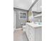 Bathroom featuring vanity with drawers and sink, toilet, shower, and mirror at 7727 W 81St Pl, Arvada, CO 80005