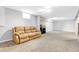 Spacious living room with neutral carpet, bright lighting, and a cozy atmosphere at 7727 W 81St Pl, Arvada, CO 80005