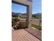 Inviting balcony view showcases a brick support, wood-style flooring, and a serene view of the neighborhood at 10150 Belvedere Loop, Lone Tree, CO 80124