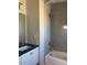 Bright bathroom with sleek vanity, contemporary fixtures, and a combined shower and bathtub at 10150 Belvedere Loop, Lone Tree, CO 80124