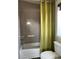 Clean bathroom featuring a combined shower and bathtub with a green curtain, and modern fixtures at 10150 Belvedere Loop, Lone Tree, CO 80124
