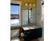 Elegant bathroom featuring sleek vanity, contemporary fixtures, and window providing natural light at 10150 Belvedere Loop, Lone Tree, CO 80124