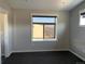 Comfortable bedroom showcases stylish accent wall, plush carpeting, and a window with natural lighting at 10150 Belvedere Loop, Lone Tree, CO 80124