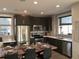 Elegant dining area with modern finishes, stainless steel appliances, and stylish dining set at 10150 Belvedere Loop, Lone Tree, CO 80124