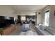Open-concept living area with a large sectional, modern furnishings, and seamless flow to the kitchen at 10150 Belvedere Loop, Lone Tree, CO 80124