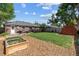 Expansive backyard with garden beds, shed and lush green lawn at 2875 Leyden St, Denver, CO 80207