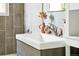 Modern bathroom with a sleek vanity, elegant sink, and neutral decor at 2875 Leyden St, Denver, CO 80207