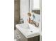 Stylish bathroom sink with modern fixtures and elegant tile backsplash at 2875 Leyden St, Denver, CO 80207