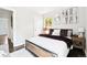 Charming bedroom with wood floors, a comfortable bed, and bright natural light at 2875 Leyden St, Denver, CO 80207