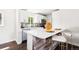 Chic kitchen with a breakfast bar, wood accents, and stainless steel appliances at 2875 Leyden St, Denver, CO 80207