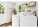 Efficient laundry room with modern appliances and ample natural light at 2875 Leyden St, Denver, CO 80207