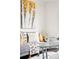 Cozy living room detail showcases a comfortable gray sofa with decorative pillows and throws at 2875 Leyden St, Denver, CO 80207