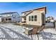 Back exterior view with fire pit and seating area at 9164 Swan River St, Littleton, CO 80125