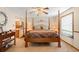 Comfortable bedroom features a four-poster bed, neutral colors, and ample natural light at 11011 Kendall Way, Westminster, CO 80020