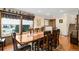 Formal dining room with hardwood floors, large windows, and an elegant dining set at 11011 Kendall Way, Westminster, CO 80020
