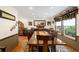 Formal dining room boasts a long table and ample lighting from a wide window view at 11011 Kendall Way, Westminster, CO 80020