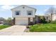 Traditional two-story home with a well-manicured lawn and attached two car garage at 11011 Kendall Way, Westminster, CO 80020