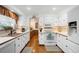 Updated kitchen boasts white appliances, wood countertops and ample cabinet space at 11011 Kendall Way, Westminster, CO 80020