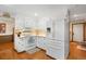 Bright kitchen featuring all white cabinetry, hardwood floors, and stainless appliances at 11011 Kendall Way, Westminster, CO 80020