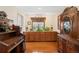 Elegant Living Room boasts wood floors and built in cabinets with display niches at 11011 Kendall Way, Westminster, CO 80020