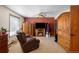 Cozy living room with a fireplace, ceiling fan, and comfortable seating at 11011 Kendall Way, Westminster, CO 80020