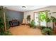 Bright living room with hardwood floors, a large window, and indoor plants at 11011 Kendall Way, Westminster, CO 80020
