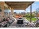 Relaxing patio with comfortable seating and a cozy fire pit, perfect for outdoor gatherings at 11011 Kendall Way, Westminster, CO 80020