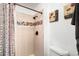 Bathroom shower with tile surround, mosaic accent, and modern fixtures at 11011 Kendall Way, Westminster, CO 80020
