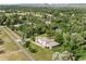 Expansive property featuring a large home, lush greenery, and a beautifully maintained lawn at 11345 W 38Th Ave, Wheat Ridge, CO 80033