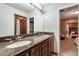 Spacious bathroom with granite counters, dual sinks and an adjoined bedroom at 11345 W 38Th Ave, Wheat Ridge, CO 80033