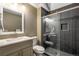 Contemporary bathroom with a glass-enclosed shower and modern vanity with sleek fixtures at 11345 W 38Th Ave, Wheat Ridge, CO 80033