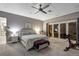 Bright bedroom featuring neutral decor, a sliding glass door and exercise bike at 11345 W 38Th Ave, Wheat Ridge, CO 80033