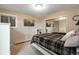 Bedroom with a window, television, and mirrored closet doors, next to a bed at 11345 W 38Th Ave, Wheat Ridge, CO 80033