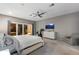 Spacious bedroom with sliding doors, white dresser, and a stationary bike at 11345 W 38Th Ave, Wheat Ridge, CO 80033