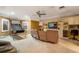 Spacious bonus room with built-in shelves, a ceiling fan, and an entertainment area at 11345 W 38Th Ave, Wheat Ridge, CO 80033