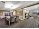 Open-concept dining room with a large wooden table and comfortable seating arrangements at 11345 W 38Th Ave, Wheat Ridge, CO 80033