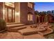 Beautiful front entrance with large wood door, stone steps, and landscaped accents at 11345 W 38Th Ave, Wheat Ridge, CO 80033