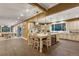 Bright kitchen area with a large island, barstool seating, and a visible adjacent living space at 11345 W 38Th Ave, Wheat Ridge, CO 80033