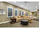Comfortable living area featuring a large sectional sofa and views into the dining space at 11345 W 38Th Ave, Wheat Ridge, CO 80033