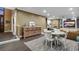 Inviting living room and dining space with a decorative credenza and modern furnishings at 11345 W 38Th Ave, Wheat Ridge, CO 80033