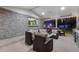Covered outdoor patio featuring comfortable seating, an outdoor kitchen, and modern design at 11345 W 38Th Ave, Wheat Ridge, CO 80033
