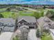 Aerial view of a brown home in a peaceful neighborhood with nearby green space at 12451 Turquoise Terrace Pl, Castle Pines, CO 80108