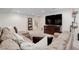 Finished basement featuring a large sectional sofa and media center at 12451 Turquoise Terrace Pl, Castle Pines, CO 80108