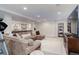 Spacious finished basement with a sectional sofa and entertainment area at 12451 Turquoise Terrace Pl, Castle Pines, CO 80108
