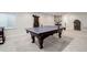 Finished basement with a high end ping pong table and adjacent seating at 12451 Turquoise Terrace Pl, Castle Pines, CO 80108